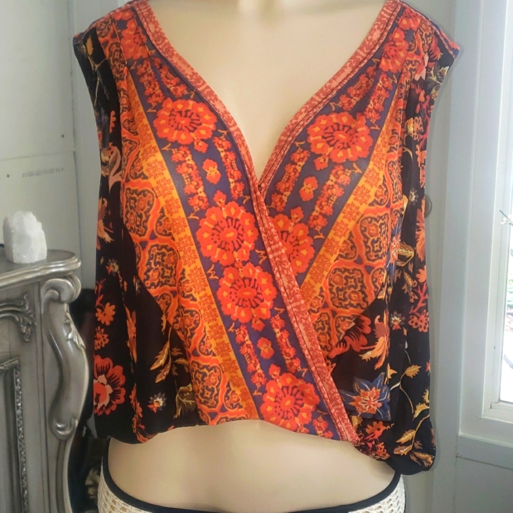 Free people blouse NWT size sm  sheer lightweight and soft.  Elastic at bottom